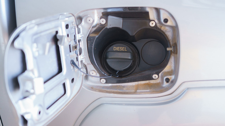 Car fuel door with residue around it