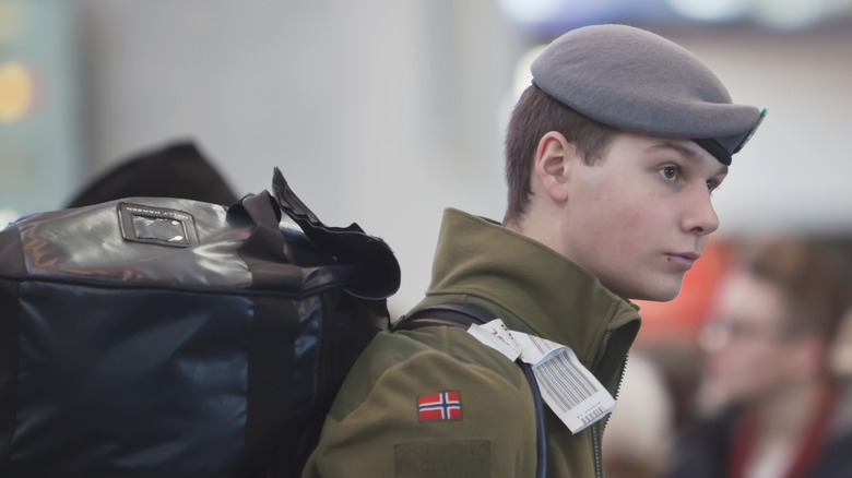 Young Norwegian soldier with backpack