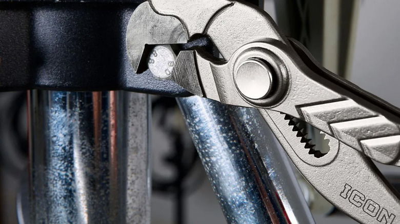 ICON parrot nose pliers being used on bolt