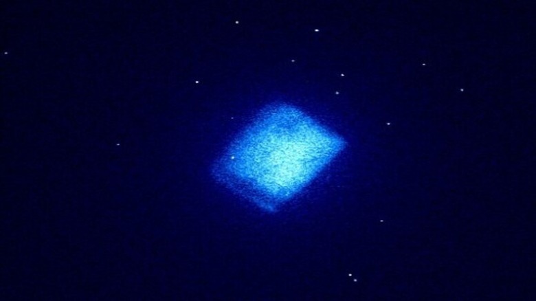 A light blue, glowing diamond battery in the middle of a dark blue background