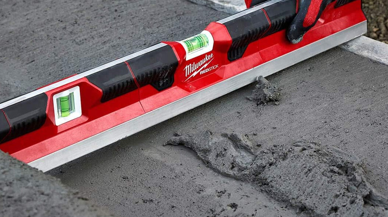 person using milwaukee level