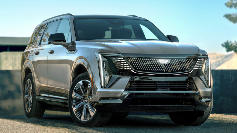 Front 3/4 view of Cadillac Escalade IQ in residential setting