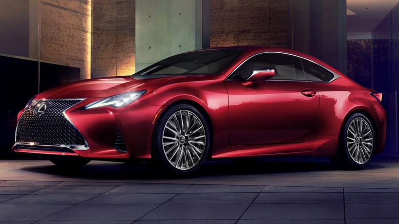 A red Lexus RC Coupe in a garage.