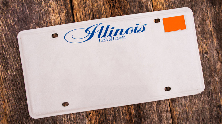 Blank Illinois license plate on a wooden table