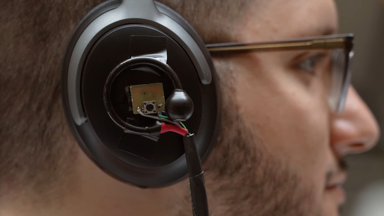 Person wearing AI headphones.