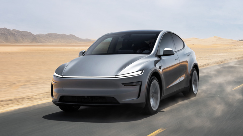 Front view of Tesla Model Y driving in the desert