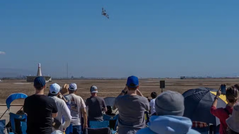 Spectators watching the flying taxis at the airshow