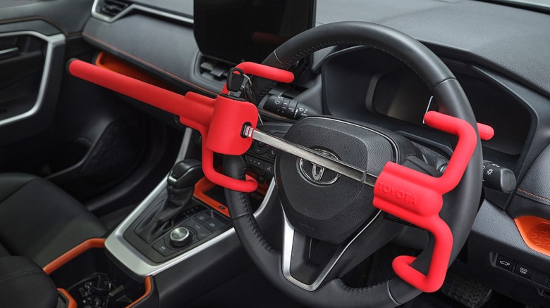 A Toyota steering wheel lock on a steering wheel.