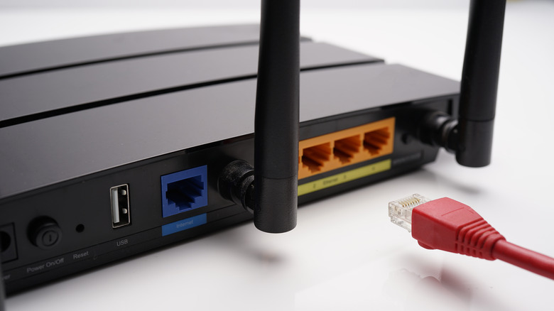 Back of a router with an unplugged Ethernet cable