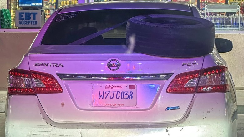 Picture displaying car with hand drawn license plate