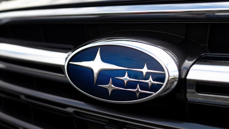Close-up of Subaru logo on a car grille