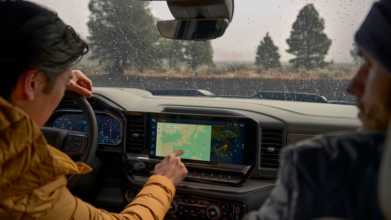 Man using Chevy SIlverado navigation touchscreen