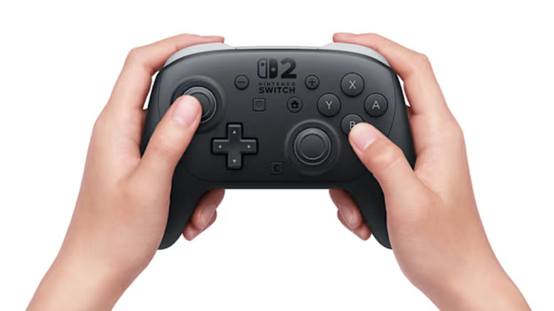 Person holding the Nintendo Switch 2 Pro controller.