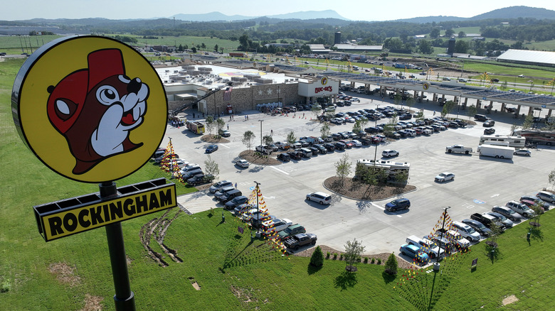 Aerial view of Buc-ee's sign with Buc-ee's store and parking lot behind it