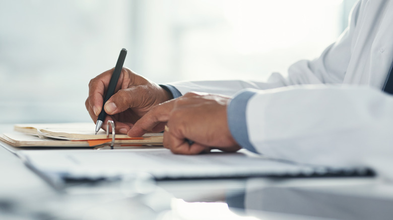 doctor writing