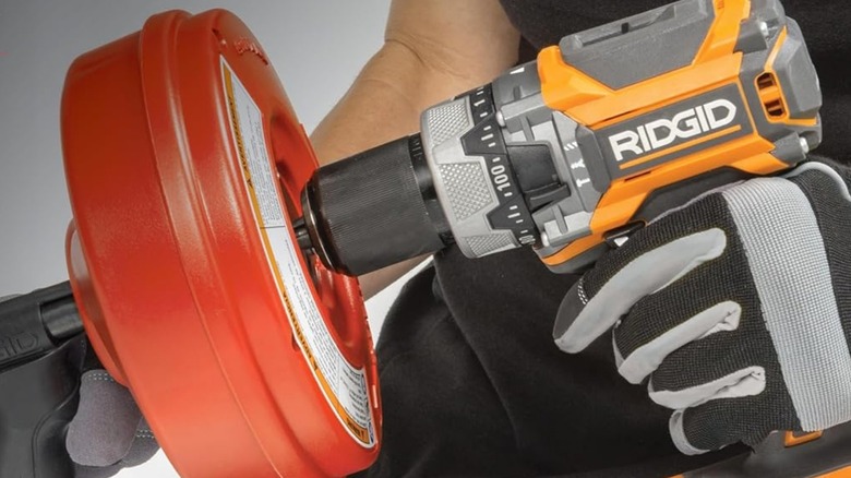 Close up of Ridgid drill attached to drain snake