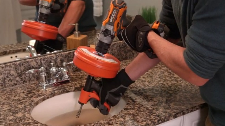 Ridgid Power Spin+ Drain Cleaner being used in sink