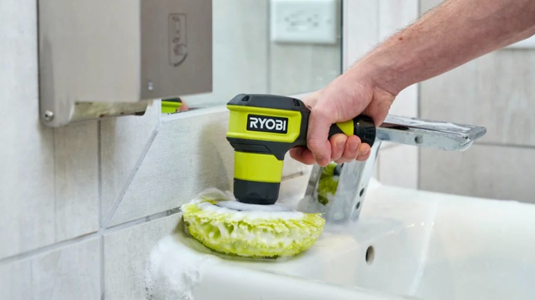Ryobi USB Lithium Power Scrubber cleaning a bathroom sink