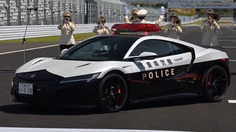 Front quarter view of second-generation Honda NSX police interceptor variant in Mie Prefecture livery on display at Suzuka Circuit