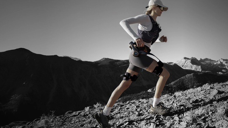 Runner going uphill while wearing Hypershell X Ultra