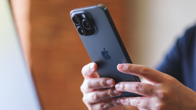 Person holding an iPhone.