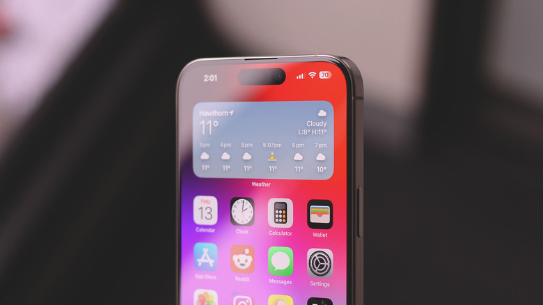 A reflective screen protector installed on an iPhone