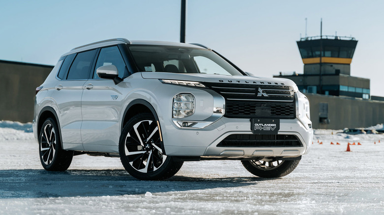 Front 3/4 of Mitsubishi Outlander PHEV parked at airport
