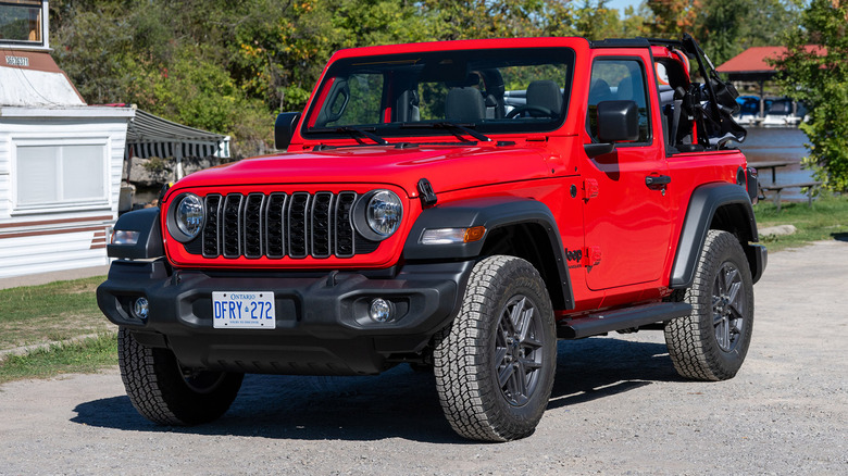 Red 2025 Jeep Wrangler Sport parked