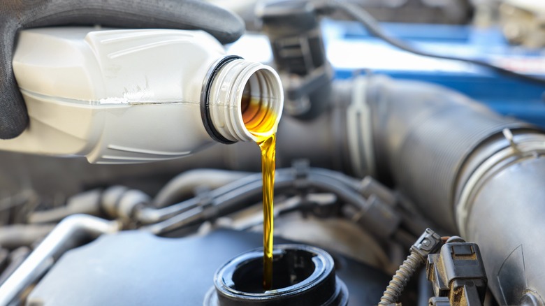 Pouring oil into an engine