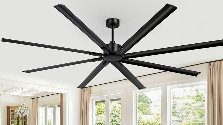 black ceiling fan in sunroom turned off