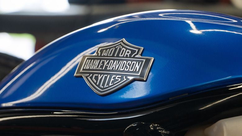 A Harley Davidson Road Glide parked outside a workshop.