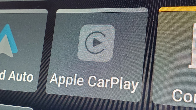 Apple CarPlay icon on screen.