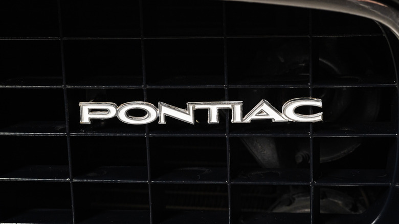 Close up of Pontiac logo on car grille
