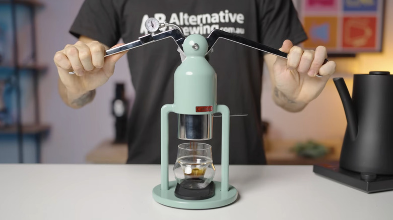 man using Cafelat Robot Barista