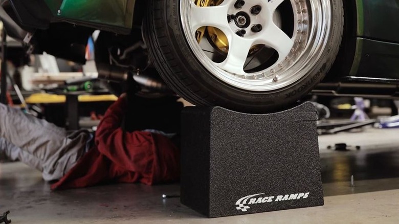 Working under a vehicle while it sits on wheel cribs