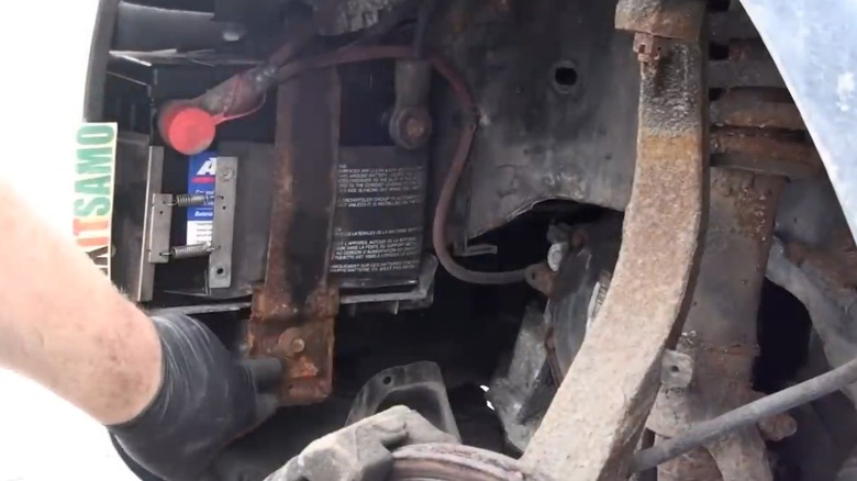 A battery compartment of a Chrysler Sebring.