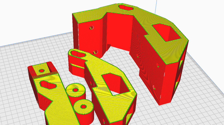 Red and yellow sliced models of a bracket designed for a Milwaukee Packout mod.
