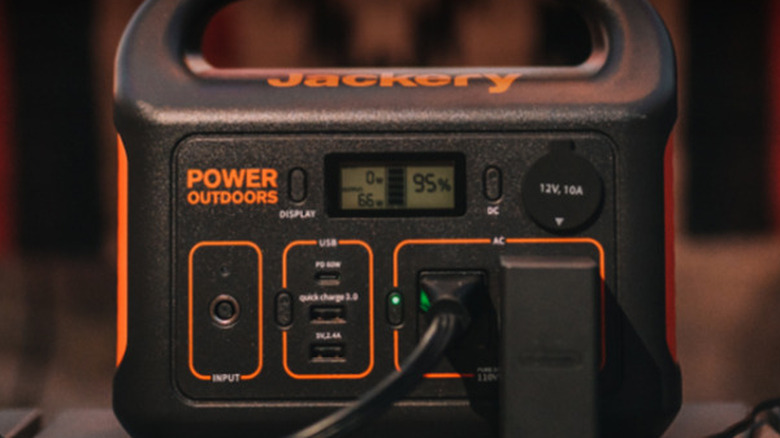 Close up of Jackery Explorer 300 with multiple cords plugged in