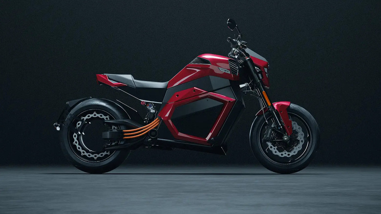 right side view of red Verge TS Pro electric motorcycle in studio