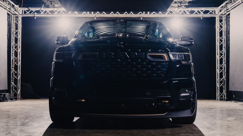 Black Fox Factory RAM 1500 lowered parked in a studio