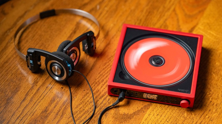 The FiiO DM15 R2R playing a disk next to the Koss Porta Pro headphones.