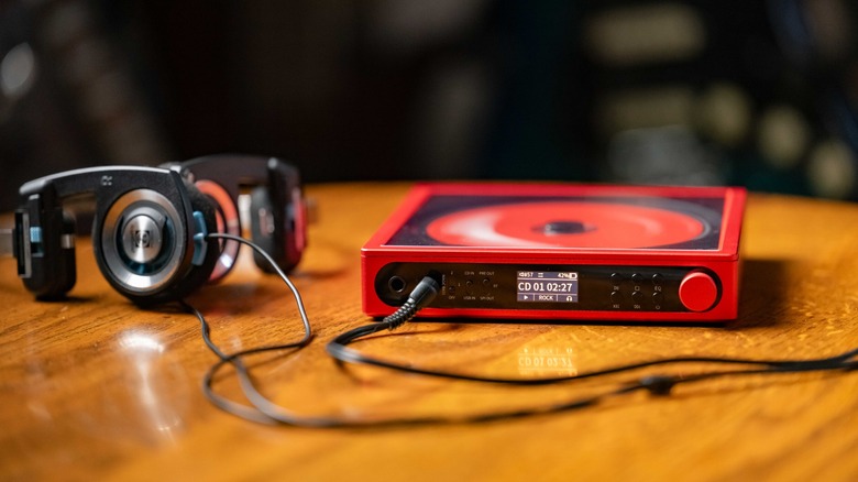 The FiiO DM15 R2R playing a disk next to the Koss Porta Pro headphones.
