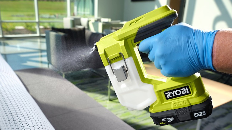 Person using Ryobi sprayer