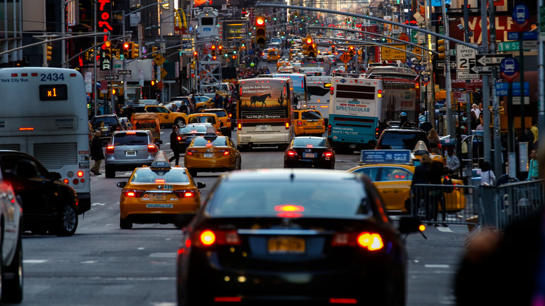 A wide scene of busy traffic in Times Square.
