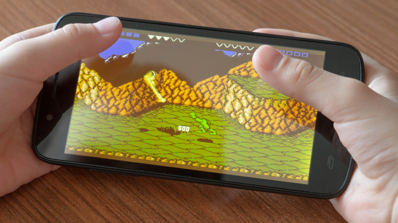 Smartphone running "Battletoads" for the NES