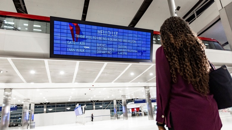 Passenger looking at Delta Parallel Reality display