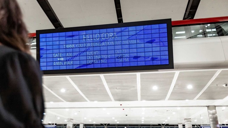 Passenger looking at Delta Parallel Reality display