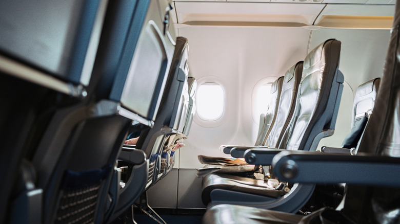 Airplane seats with recline buttons