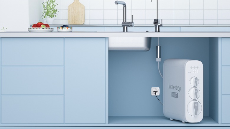 Waterdrop Filter G3P800 installed under sink in kitchen with blue cabinets