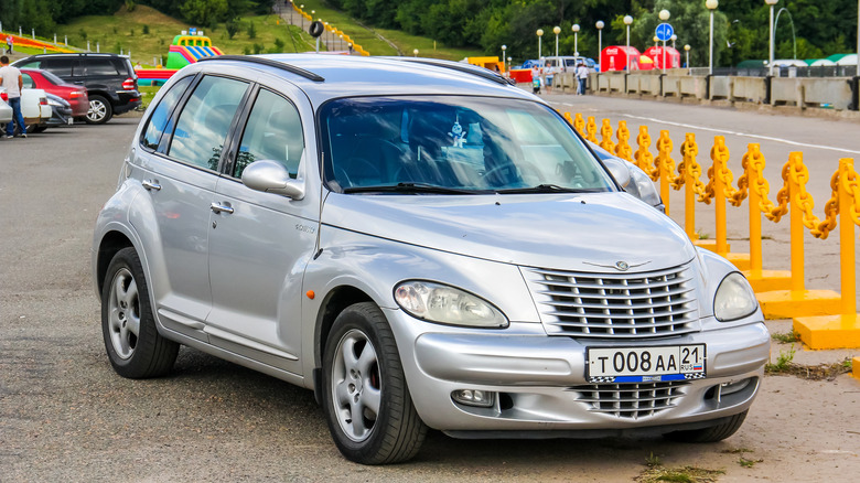 A silver Chrysler PT Cruiser in parking lot